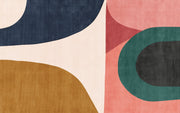 Earthy geometric wall mural with abstract curved shapes in green, ochre, navy, and blush, creating a modern and minimalist bedroom atmosphere.