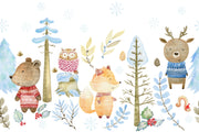 Winter woodland animal wall mural featuring a bear, fox, deer, and owl in cozy knitted sweaters, surrounded by snow-covered trees and soft blue foliage.