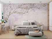Soft pink and lavender floral wall mural with delicate blossoms on intertwining branches, creating a serene and elegant ambiance.