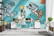 Playful astronaut-themed wall mural featuring astronauts, rockets, planets, and comets, ideal for kids’ bedroom or playroom decoration.