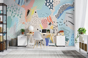 Playful abstract wall mural with colorful brushstrokes, dotted patterns, and modern art elements in a bedroom setting