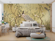 Golden Bloom wall mural with a cream peacock, flowering tree branches, and birds on a golden background in an elegant, Chinoiserie-style interior.