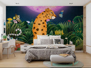 Midnight Safari wall mural with a whimsical leopard in a vibrant jungle, surrounded by butterflies and a glowing purple moon, styled in a cozy bedroom.