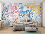 Multicolor zebra wall mural featuring vibrant pink, blue, orange, and yellow zebras on a white background, ideal for modern decor.