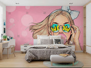 Trendy pop art wall mural featuring a stylish girl with sunglasses and bubble gum on a pink background.