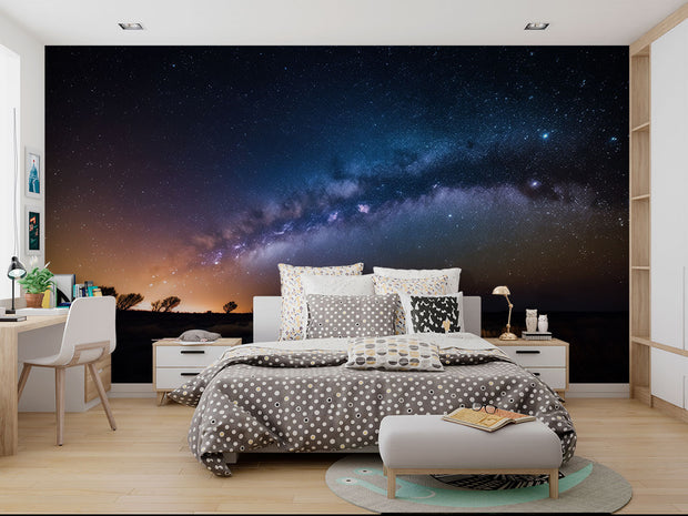 Milky Way Night Sky Wall Mural – Stunning Galaxy Wallpaper Featuring a Starry Sky, Deep Cosmic Blues, and Twilight Horizon for Celestial-Inspired Interiors.