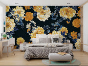 Midnight bloom wall mural featuring large yellow and cream flowers with deep blue foliage on a dark background, creating a dramatic and elegant room atmosphere.