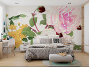 Wall mural with vintage-style pink and white roses, yellow chrysanthemums, and green foliage decorating a bedroom.