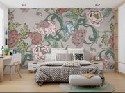 Garden bloom wall mural with pastel pink, green, and blue peonies and leaves, styled in a bedroom.