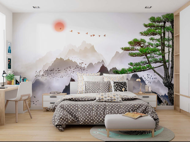 Minimalist Japanese mountain landscape wall mural with coral sunset and flying birds, styled in a modern bedroom.