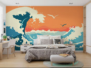 Abstract ocean wave wall mural and wallpaper in vibrant orange and blue tones, styled in a bedroom. 
