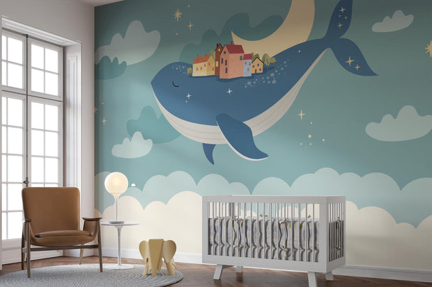 Whale and moon wall mural with a floating village, clouds, and a starry night sky, ideal for kids' rooms and nurseries.