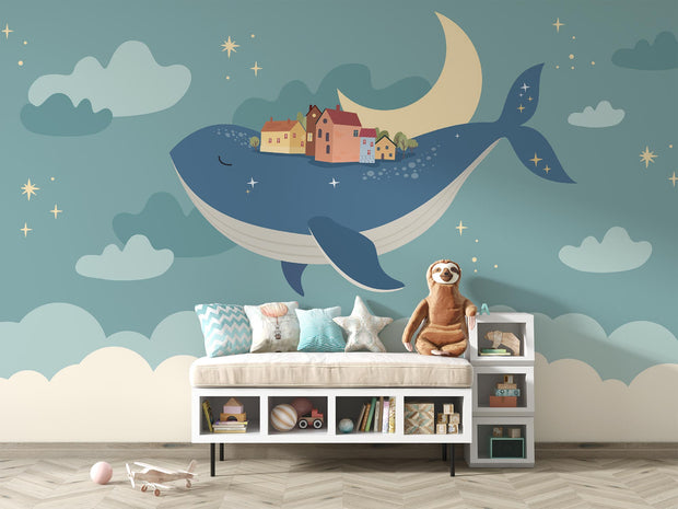 Whale and moon wall mural with a floating village, clouds, and a starry night sky, ideal for kids' rooms and nurseries.