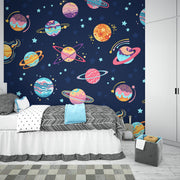 Space-themed wall mural for kids featuring colorful planets, stars, and galaxies on a navy blue background, perfect for children's room decor.