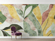 Abstract watercolor leaf wall mural with earthy green, yellow, and terracotta tones in a modern botanical design.