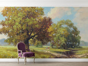 Hand-painted style wall mural featuring golden trees, a countryside meadow, and a walking path under a soft sky.