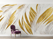 Modern abstract wall mural with golden and beige feather leaf patterns behind an arm chair.