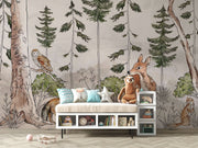 A charming woodland wall mural featuring a deer, fox, owl, and lush greenery surrounded by tall trees. Perfect for kid's rooms or nature-themed nurseries.