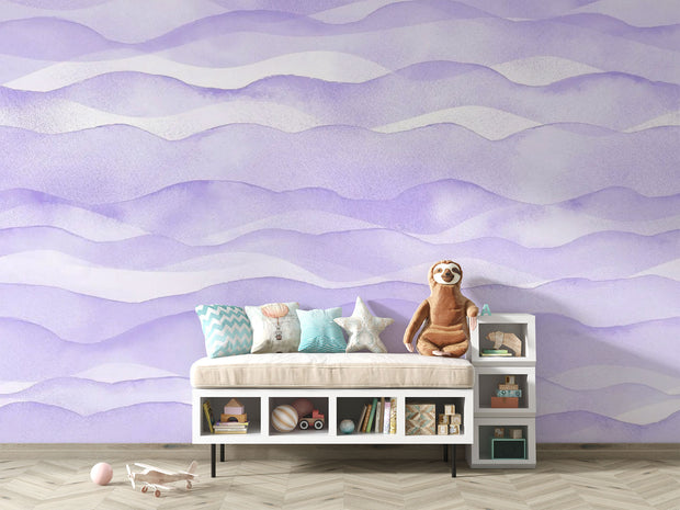 Purple wave-pattern wall mural with soft flowing designs, decorating a cosy children’s playroom.