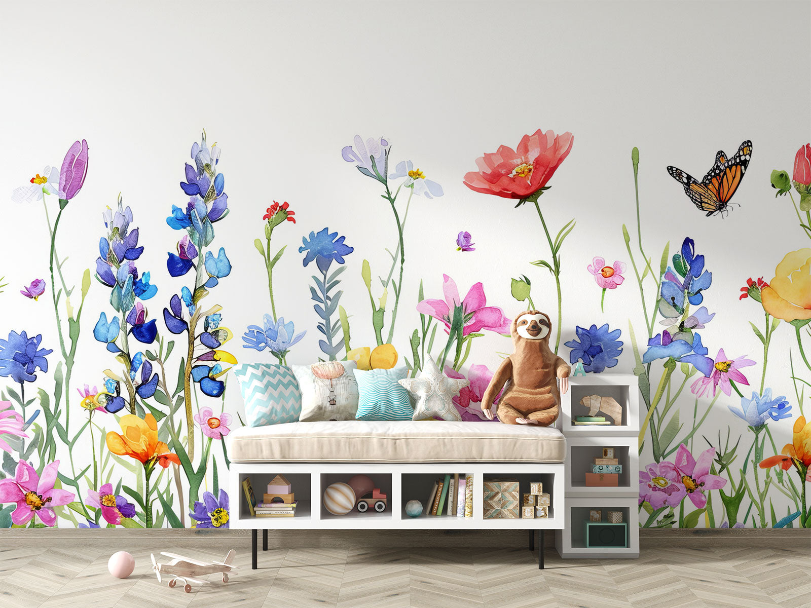 Watercolor wildflower wall mural featuring hand-painted flowers in vibrant colors with butterflies, styled in a playful children’s room with a white teepee.