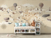Vintage-style children's world map wall mural with hot air balloons and animals, styled in neutral nursery.