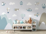Aviation-themed wall mural for kids featuring airplanes, helicopters, hot air balloons, and mountains in soft pastel colors, perfect for a nursery or playroom.