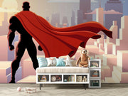 Wall mural depicting a superhero in a red cape looks over the city.