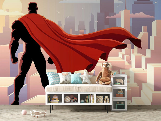 Wall mural depicting a superhero in a red cape looks over the city.