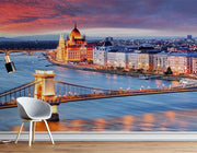 Budapest Skyline Wall Mural featuring the Hungarian Parliament, Chain Bridge, and the Danube River glowing under a vibrant sunset.