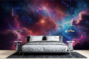 Celestial nebula wall mural featuring vibrant clouds of cosmic gas in blues, purples, and reds with glowing stars, styled in a modern bedroom.