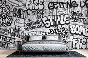 Graffiti wall mural with black-and-white street art typography and spray paint elements, ideal for urban-inspired bedrooms or creative spaces.
