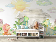 Pastel dinosaur wall mural with soft watercolor-style dinosaurs, a cozy stone cave, lush greenery, and a glowing sun, perfect for nurseries and playrooms.