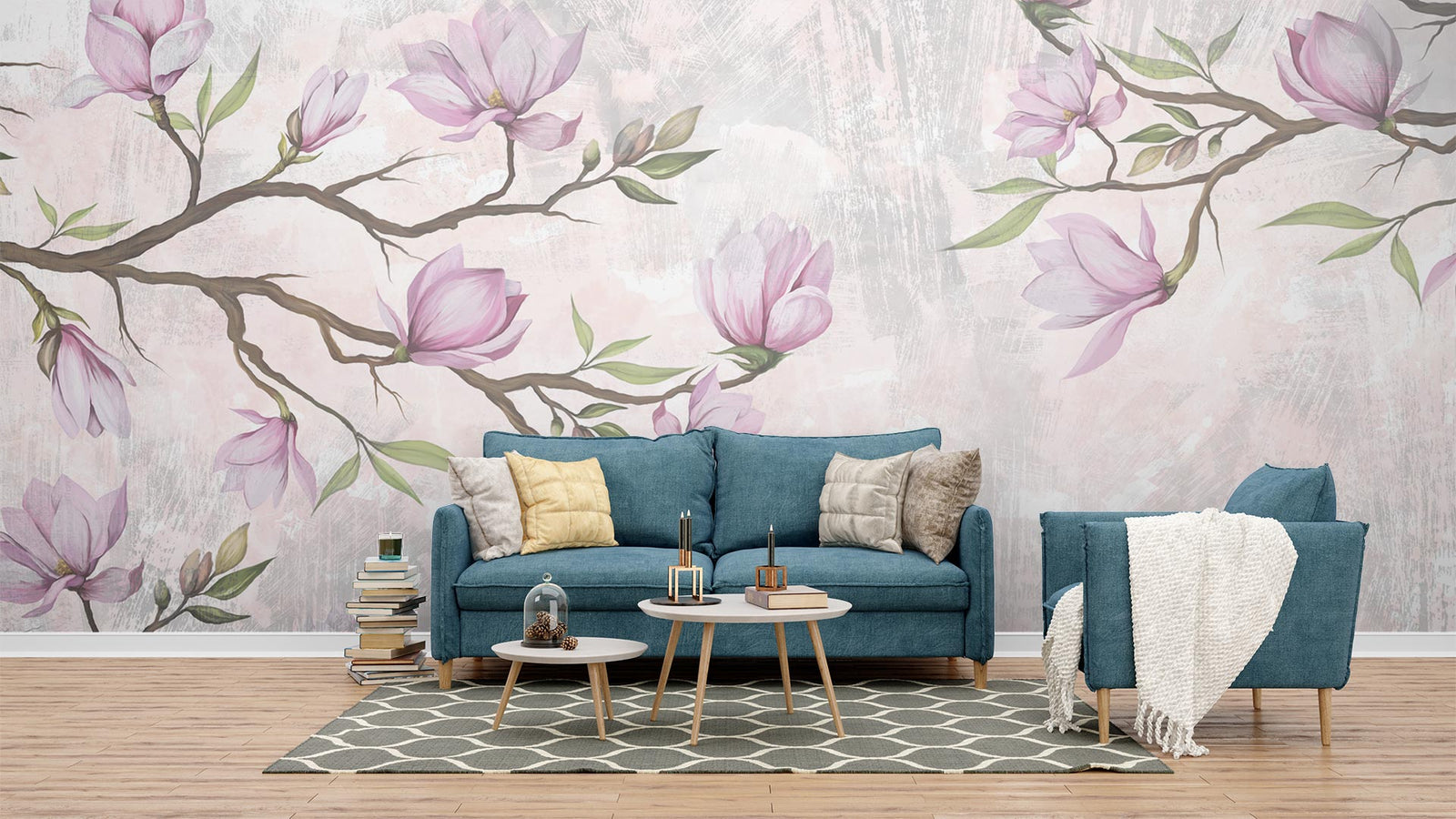 Pink Magnolia Wall Mural with blooming branches on a textured background in a cozy living room with blue sofa and modern decor.