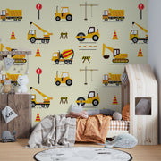 Excavators and dumpers wall mural featuring yellow trucks, cranes, diggers, and traffic cones on a light background, perfect for a boy's bedroom.