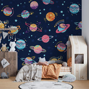 Space-themed wall mural for kids featuring colorful planets, stars, and galaxies on a navy blue background, perfect for children's room decor.