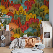 Vibrant Forest Wall Mural featuring colorful abstract trees in red, orange, green, and blue tones, ideal for modern and artistic interiors.