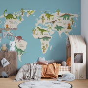 Dinosaur world map wall mural featuring illustrated dinosaurs on different continents, set against a blue background, perfect for kid's rooms and playrooms.