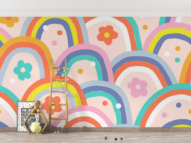 Kids wall mural with retro-style rainbow arches and colorful flowers in a playful, children's playroom.