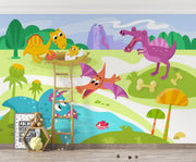 A playful dinosaur wall mural with bright cartoon-style dinosaurs, a volcano, greenery, and prehistoric elements in a kids' room.