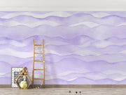 Purple wave-pattern wall mural with soft flowing designs, decorating a cosy children’s playroom.