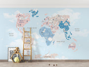 Pastel dinosaur world map wall mural featuring adorable prehistoric creatures, soft blue and pink tones and a whimsical design; perfect for kid's rooms and nurseries.