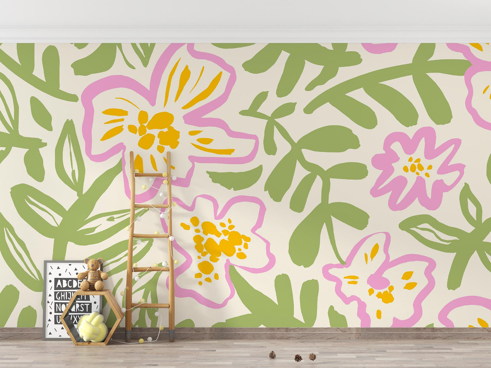Floral wall mural with bold pink and yellow flowers and green leaves, decorating a nursery.