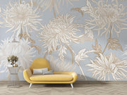 Elegant blue floral wall mural with intricate beige and gold chrysanthemums, styled in a modern living room with a yellow sofa.