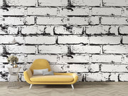 Black and white distressed brick wall mural, industrial faux brick wallpaper for modern bedroom decor.

