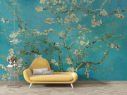 Wall mural of almond blossoms on a turquoise background, inspired by classic artwork, enhancing a modern living room with artistic elegance.