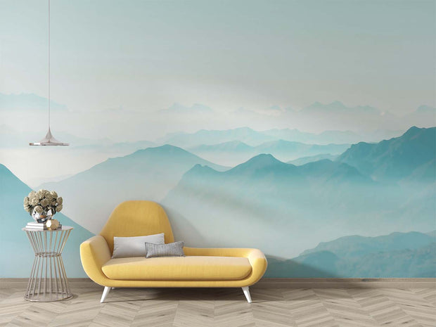 Serene misty mountain wall mural with soft blue gradient layers, creating a peaceful atmosphere in a modern living room  setting.