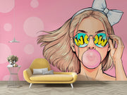 Trendy pop art wall mural featuring a stylish girl with sunglasses and bubble gum on a pink background.