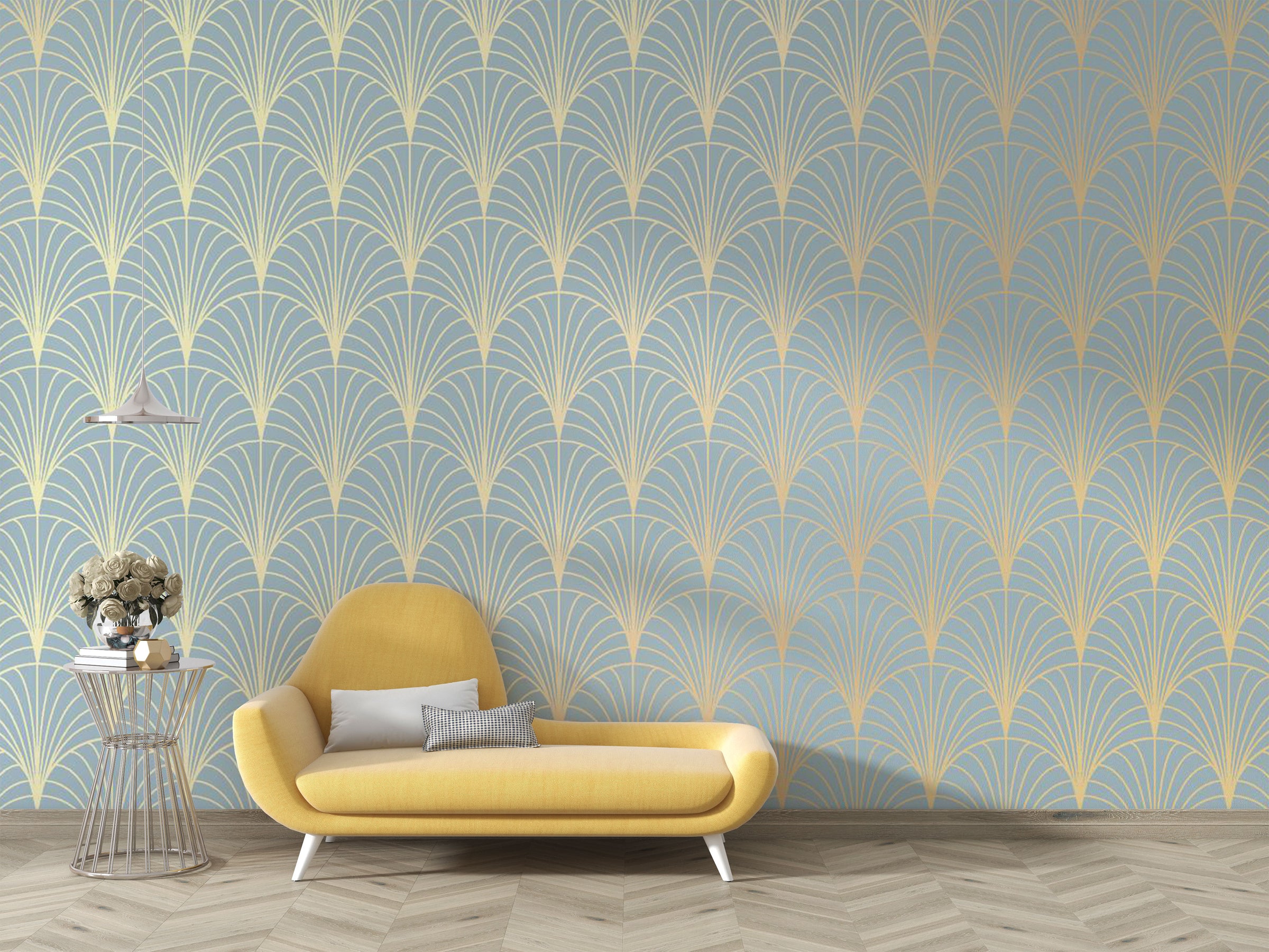 Art Deco wallpaper mural in blue and gold with fan pattern behind a yellow chaise lounge.
