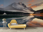 Escape into nature with the Majestic Mountain Lake Wall Mural. Featuring a serene mountain reflection at sunset, perfect for bedrooms and living spaces.