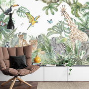 Safari adventure wall mural featuring watercolor jungle animals such as lions, giraffes, zebras, and parrots, styled in a cozy kids' playroom.